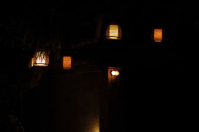 Low angle view of illuminated house at night