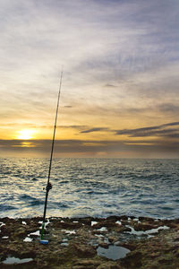 Scenic view of sea against sky at sunset