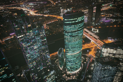 High angle view of illuminated buildings in city at night