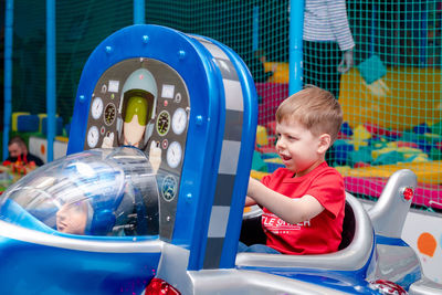 Cute boy playing with toy