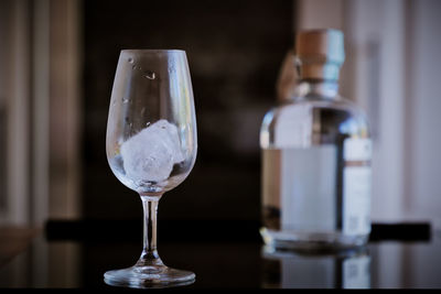 Close-up of wine in glass on table