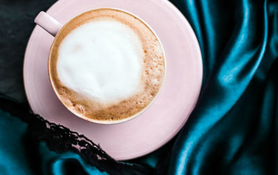 Midsection of woman holding coffee