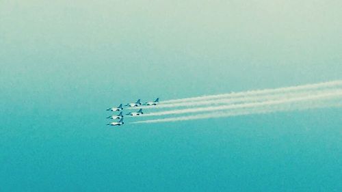 Airplane flying against sky