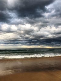 Scenic view of sea against cloudy sky