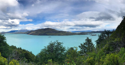 Scenic view of lake and mountains against sky