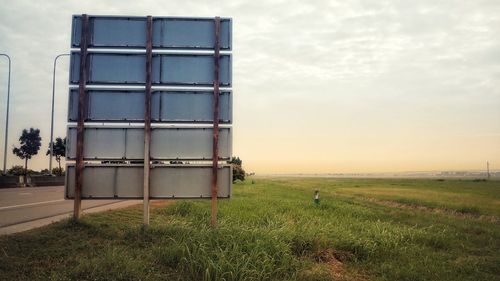 Built structure on field against sky
