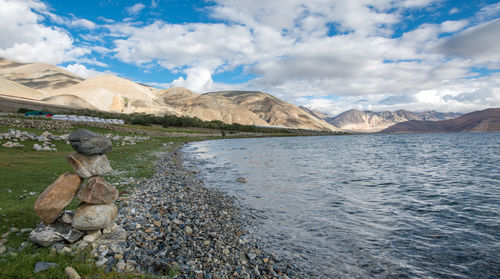 Scenic view of lake and mountains against sky