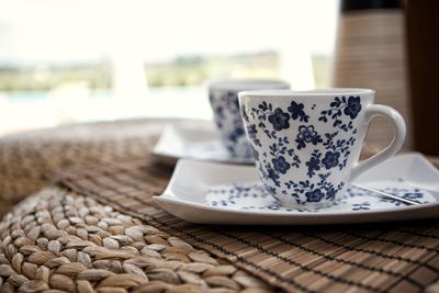 Close-up of coffee cup on table