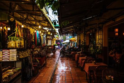People at market in city at night
