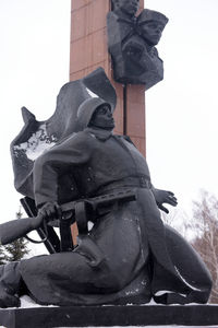 Low angle view of statue against sky