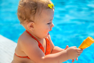 Close-up of young woman holding ice cream