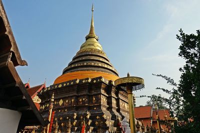 Low angle view of pagoda against buildings