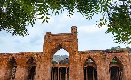 Ancient grand mosque called adhai din ka jhonpra vintage architecture with bright blue sky at day