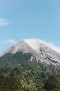 Scenic view of volcanic mountain against sky