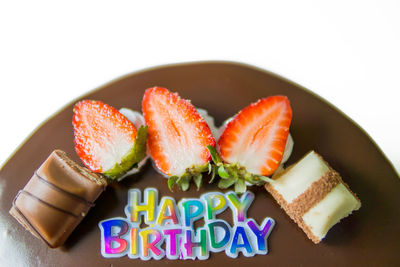 Close-up of candies against white background