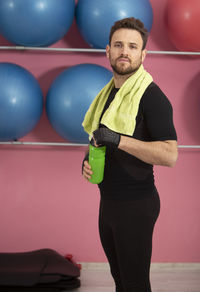 Portrait of man standing on balloon