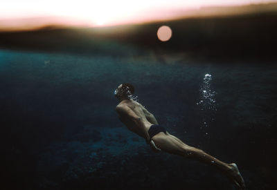 Man swimming in sea