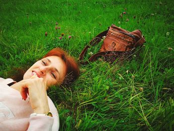 Portrait of a smiling young woman on field