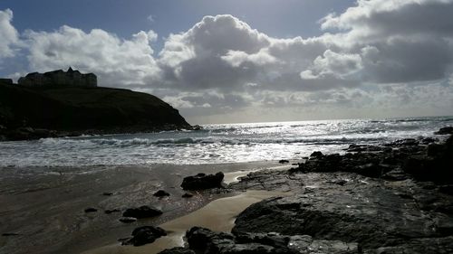 Scenic view of sea against cloudy sky