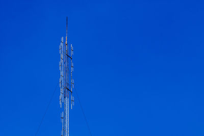 Transmission tower on a clear day.