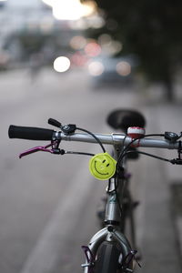 Close-up of bicycle parked on street