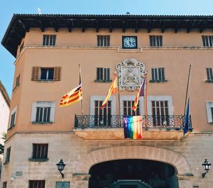 Low angle view of flags on balcony