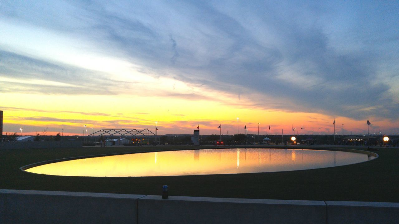 sunset, sky, cloud - sky, built structure, transportation, architecture, orange color, silhouette, illuminated, dusk, water, cloud, building exterior, city, cloudy, outdoors, yellow, scenics, bridge - man made structure, nature