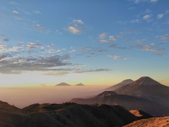 Scenic view of mountains against sky during sunset