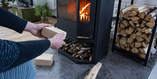 Cropped hand of man preparing food