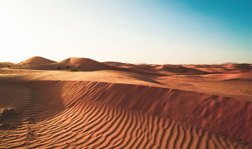 Scenic view of desert against clear sky