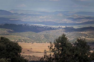 High angle view of landscape and mountains against sky