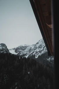 Scenic view of snowcapped mountains against clear sky