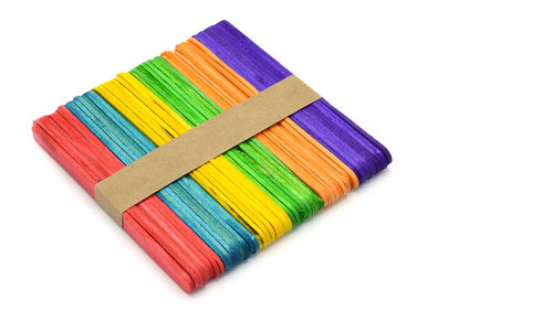 High angle view of multi colored pencils against white background