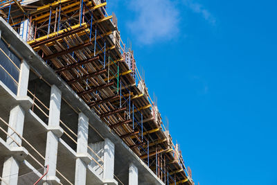 Low angle view of building against blue sky