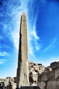 Low angle view of obelisk against blue sky