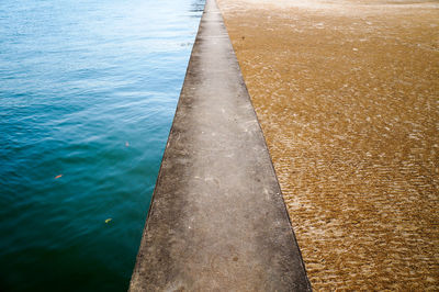 High angle view of swimming pool by sea