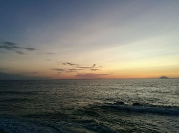 Scenic view of sea against sky at sunset