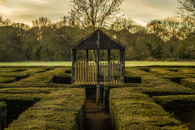 Gazebo in park against sky during sunset