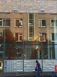 Woman standing in front of building