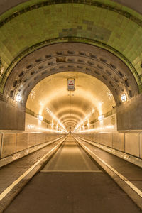 Illuminated tunnel at subway station