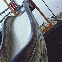 Tilt shot of wet slide in playground