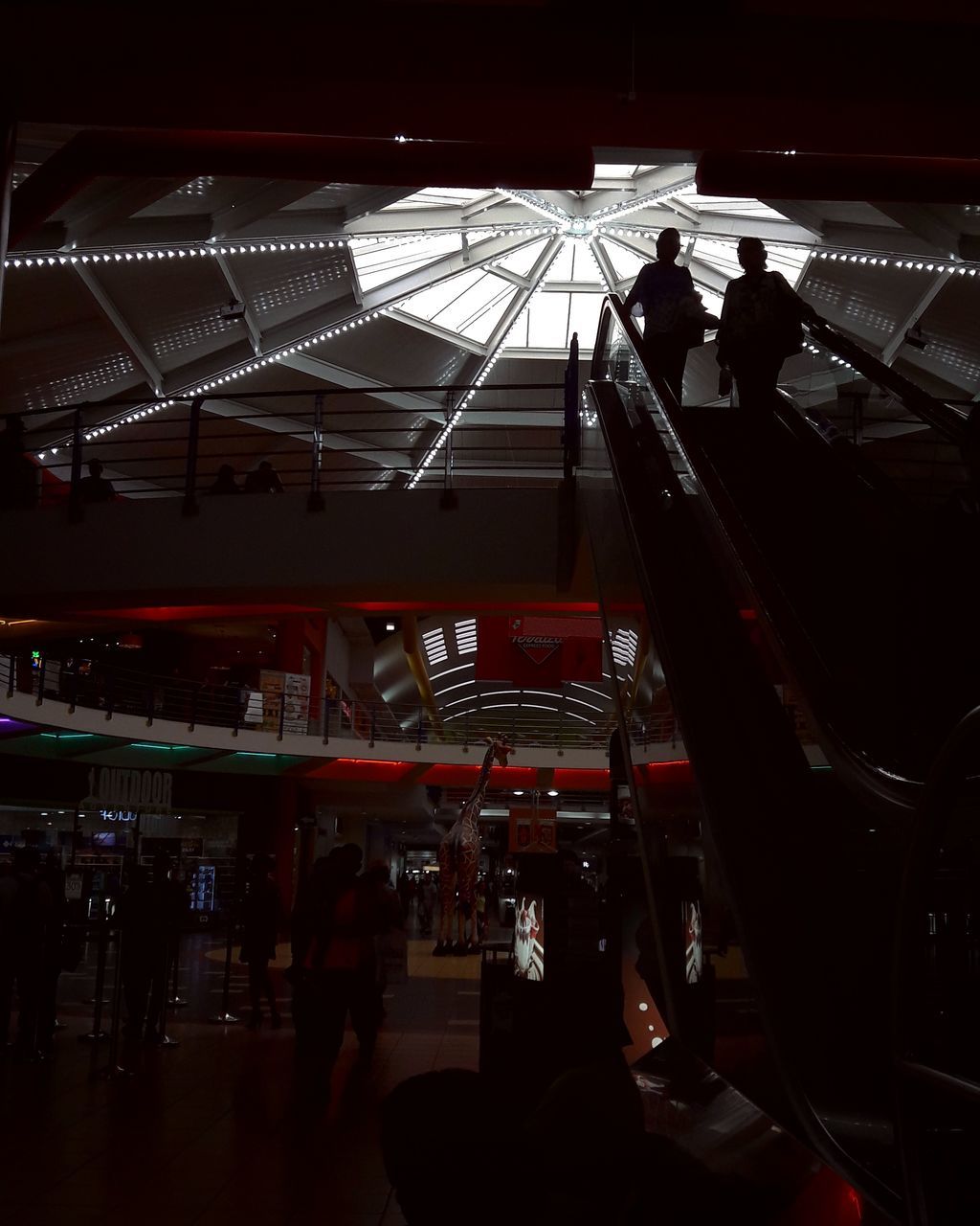 GROUP OF PEOPLE IN ILLUMINATED BUS