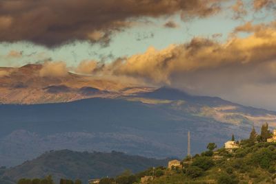 Scenic view of mountains against sky during sunset