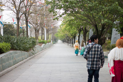 Tourists walking on walkway