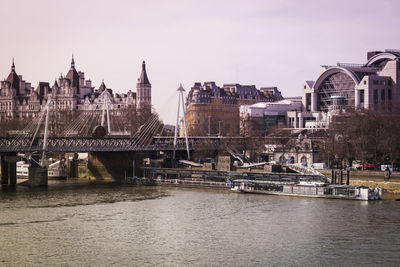 View of bridge over river in city