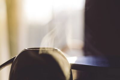 Close-up of tea cup on table at home