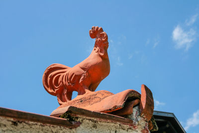 Low angle view of statue against clear blue sky