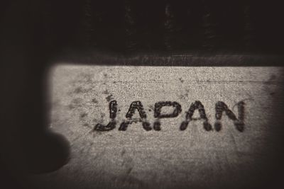 Close-up of text on wall