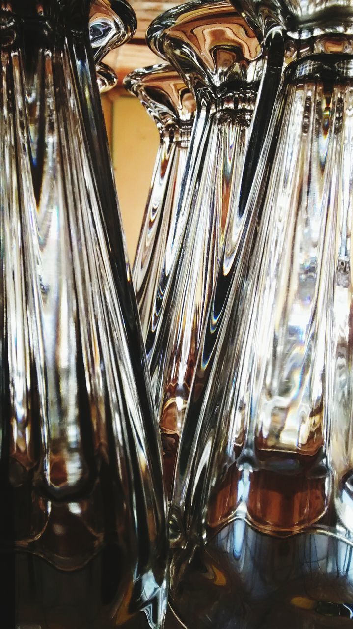 indoors, still life, close-up, glass - material, table, no people, large group of objects, transparent, reflection, window, in a row, hanging, focus on foreground, home interior, drinking glass, jar, abundance, wood - material, day, metal