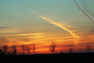 Scenic view of silhouette landscape against romantic sky